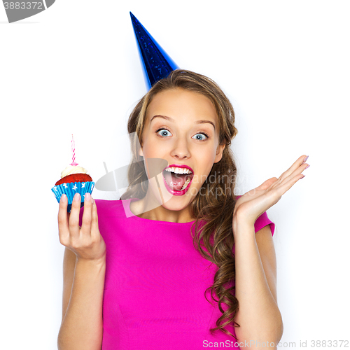 Image of happy woman or teen girl with birthday cupcake
