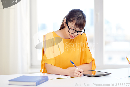 Image of asian woman student with tablet pc at home