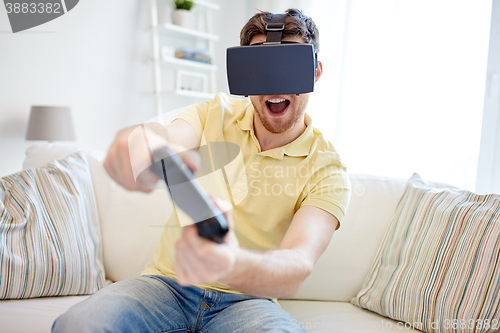 Image of man in virtual reality headset with controller