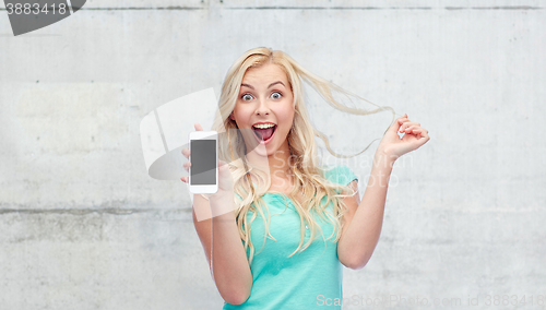 Image of happy young woman or teenage girl with smartphone