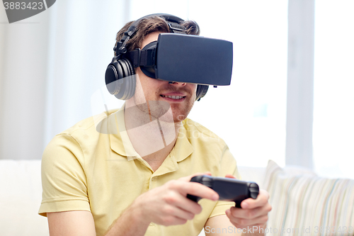 Image of man in virtual reality headset with controller