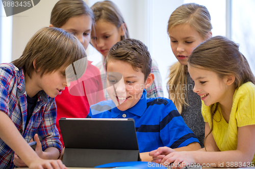 Image of group of school kids with tablet pc in classroom