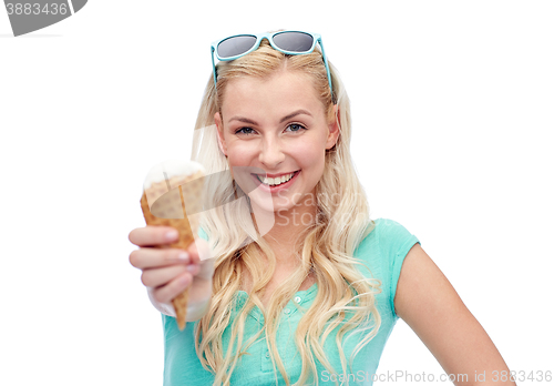 Image of happy young woman in sunglasses eating ice cream