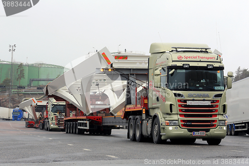 Image of Two Scania Trucks Haul Long Industrial Object 