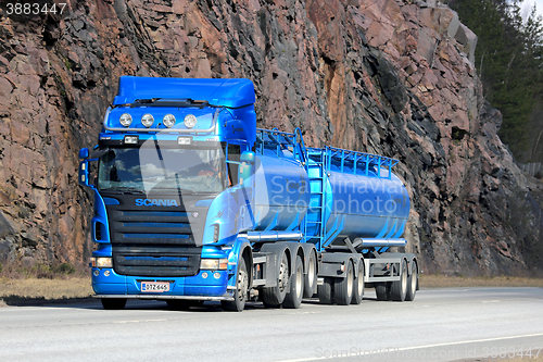 Image of Blue Scania Tank Truck with Rock Face Background