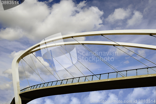 Image of pedestrian bridge against the blue sky