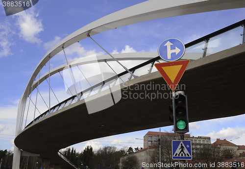 Image of pedestrian bridge and traffic light