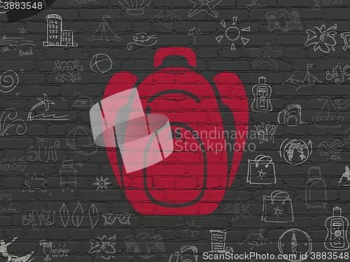 Image of Tourism concept: Backpack on wall background