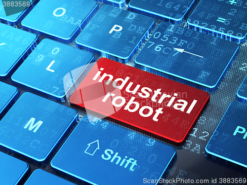 Image of Manufacuring concept: Industrial Robot on computer keyboard background
