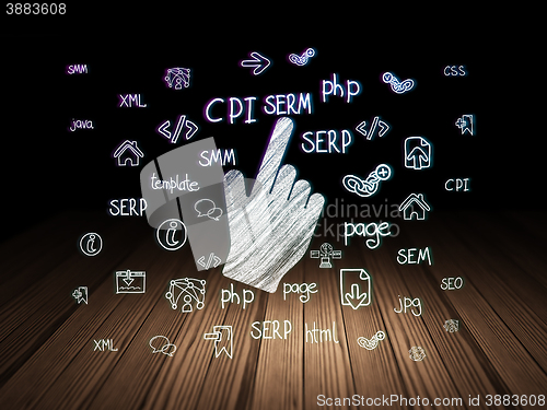 Image of Web development concept: Mouse Cursor in grunge dark room