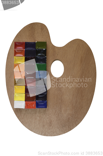Image of watercolor paint and wooden palette on white background