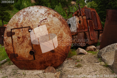 Image of rusty wrecks, adapted for barn on the shore