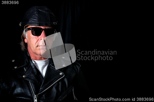 Image of old school biker on black