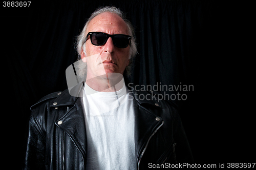 Image of older grey haired biker