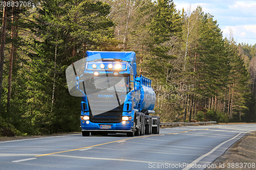 Image of Blue Scania Tank Truck on Rural Highway at Spring