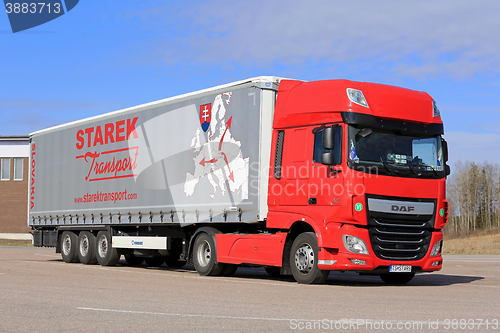 Image of New Red DAF XF Semi Truck and Blue Sky