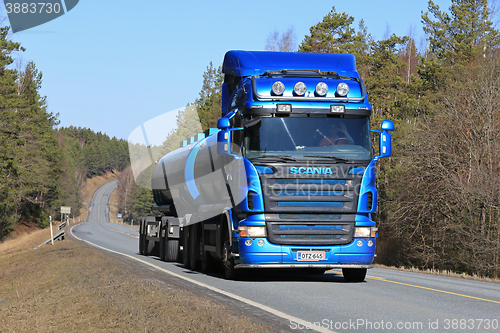 Image of Blue Scania Tank Truck on Rural Road at Spring