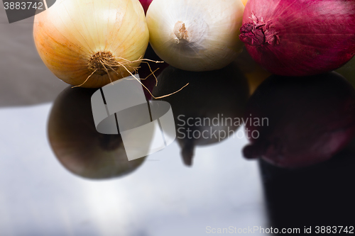 Image of some onions on a black background