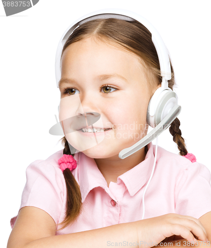 Image of Young girl is working as an operator at helpline