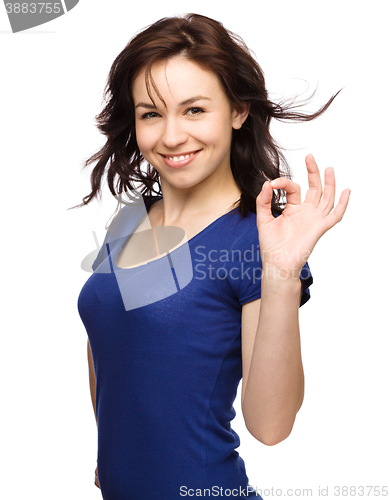 Image of Woman is showing OK sign