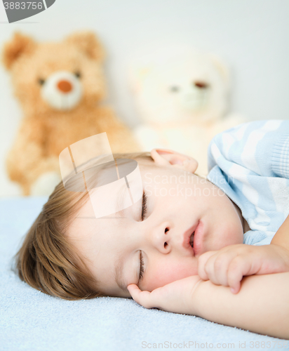 Image of Little boy is sleeping