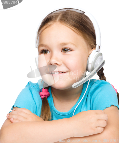 Image of Young girl is working as an operator at helpline