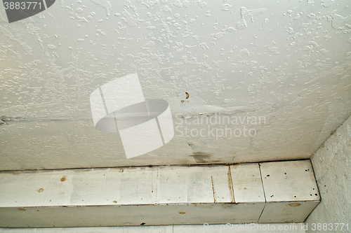 Image of water damage to ceiling from rain leak