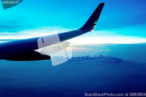 Image of aircraft wing on blue sky