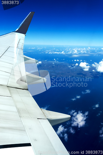 Image of aircraft wing on blue sky
