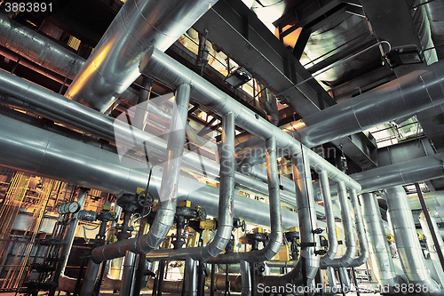 Image of Equipment, cables and piping as found inside of a modern industr