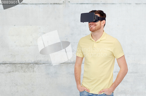 Image of happy man in virtual reality headset or 3d glasses