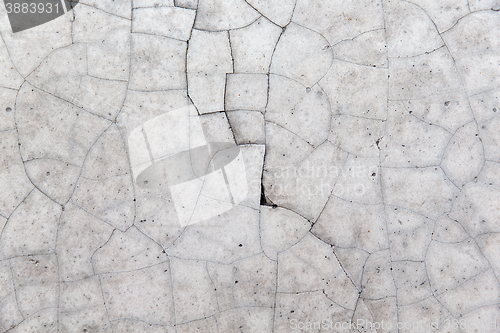 Image of cracked gray concrete wall texture