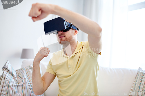 Image of young man in virtual reality headset or 3d glasses