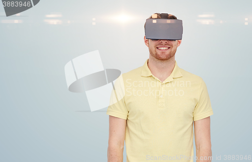 Image of happy man in virtual reality headset or 3d glasses