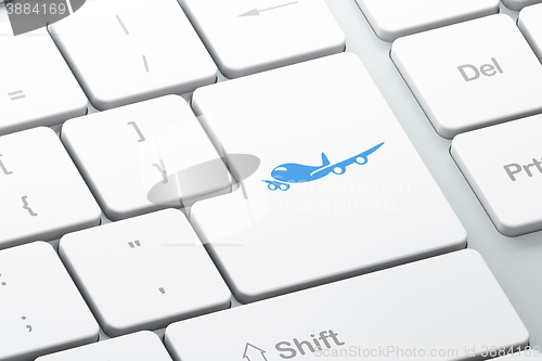 Image of Tourism concept: Airplane on computer keyboard background