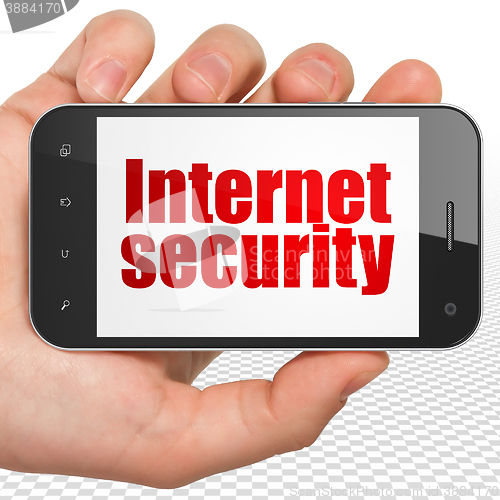 Image of Safety concept: Hand Holding Smartphone with Internet Security on display