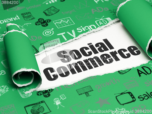 Image of Marketing concept: black text Social Commerce under the piece of  torn paper