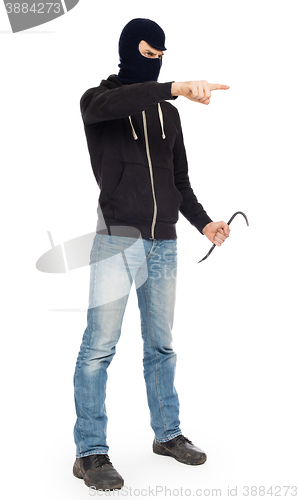 Image of Thief with metal crowbar