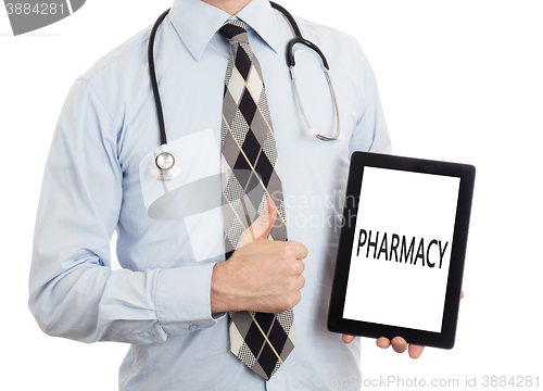 Image of Doctor holding tablet - Pharmacy