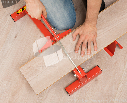 Image of Red tool for cutting laminate