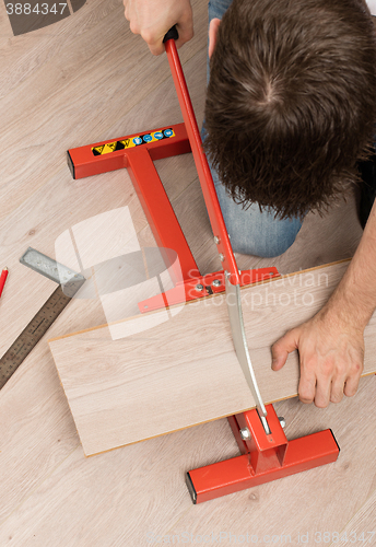 Image of Red tool for cutting laminate