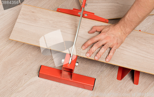 Image of Red tool for cutting laminate