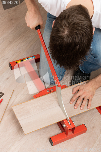 Image of Red tool for cutting laminate