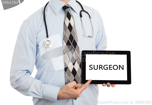 Image of Doctor holding tablet - Surgeon