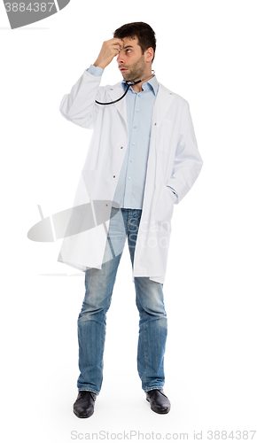 Image of Humorous portrait of a young depressed surgeon with a stethoscop