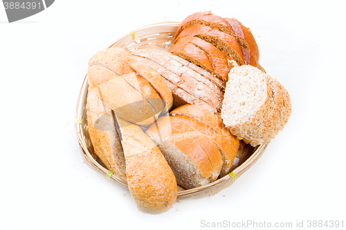 Image of bread in a wicker breadbasket on white background