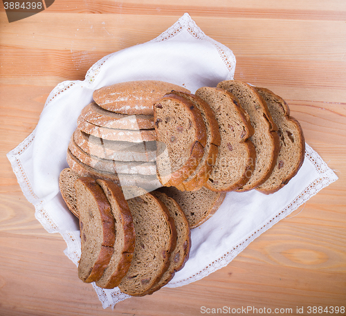 Image of Freshly baked bread with homespun fabric 