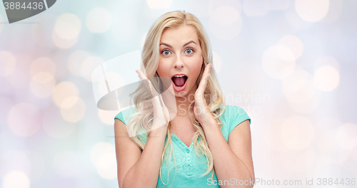 Image of surprised smiling young woman or teenage girl