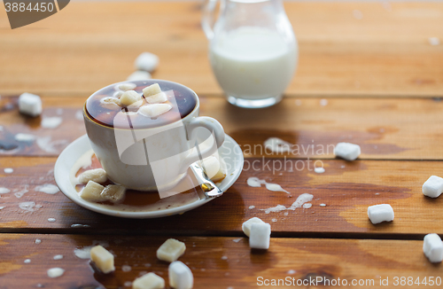 Image of close up of sugar in coffee cup on wooden table