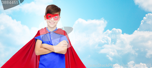 Image of boy in red super hero cape and mask
